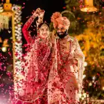 Traditional wedding attire with rose petal shower.