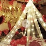 Luxury Cabana Anniversary Room Decoration Package featuring fairy lights, heart balloons, and cabana canopy by Dream Spark Events
