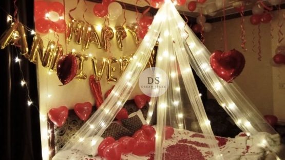 Luxury Cabana Anniversary Room Decoration Package featuring fairy lights, heart balloons, and cabana canopy by Dream Spark Events