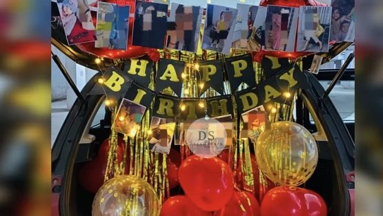 Elegant Car Dikki Birthday Decoration in Delhi NCR with red and gold balloons, fairy lights, and photo garland by Dream Spark Events