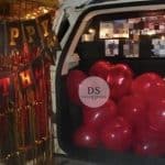 Luxury Car Dikki Surprise Decoration in Delhi NCR with red balloons and fairy lights by Dream Spark Events