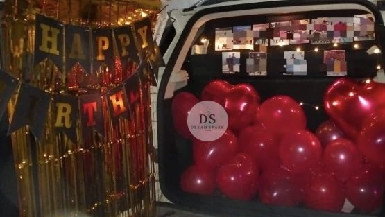 Luxury Car Dikki Surprise Decoration in Delhi NCR with red balloons and fairy lights by Dream Spark Events