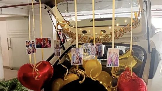 Elegant Congratulations Car Dikki Decoration in Delhi NCR with gold and red balloons, photo clips, and backdrop by Dream Spark Events