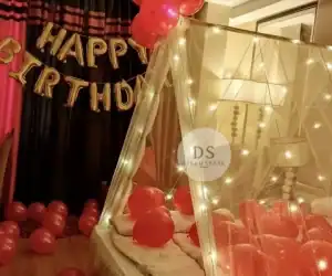Cabana Birthday Decoration with fairy lights, red balloons, and canopy setup by Dream Spark Events in Delhi NCR