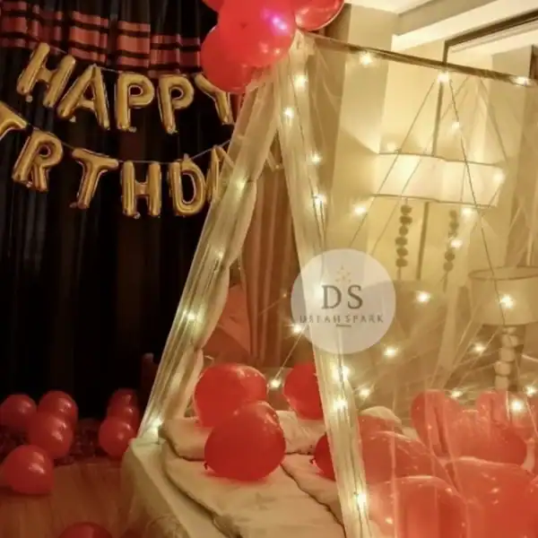 Cabana Birthday Decoration with fairy lights, red balloons, and canopy setup by Dream Spark Events in Delhi NCR