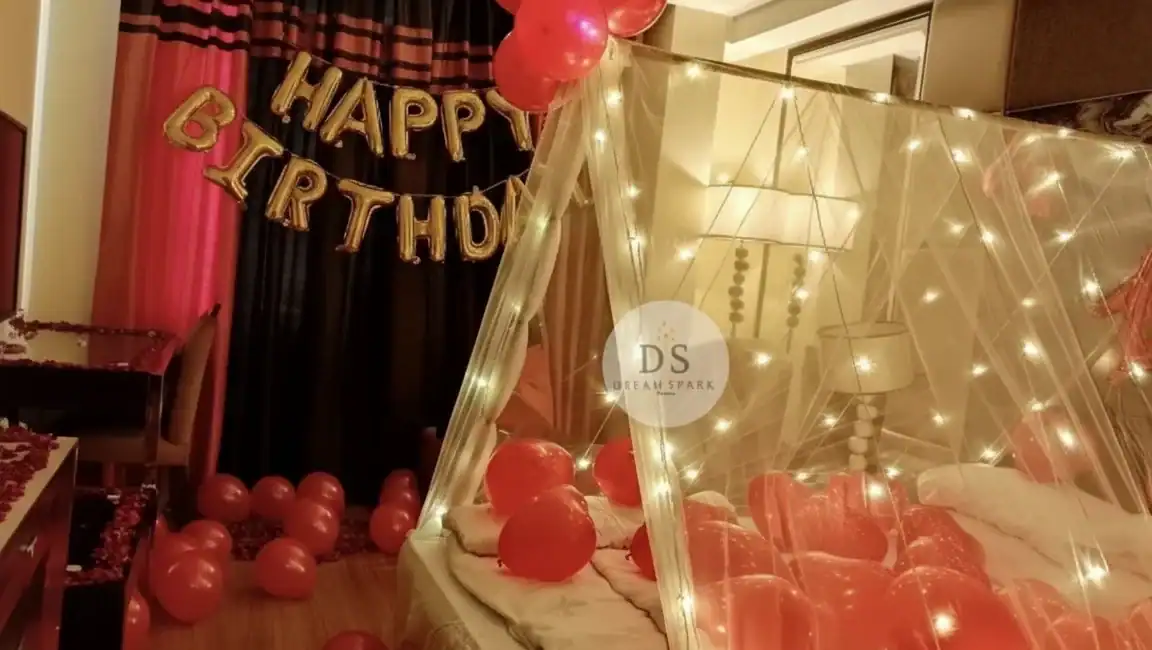 Cabana Birthday Decoration in Delhi NCR 1 Cabana Birthday Decoration with fairy lights, red balloons, and canopy setup by Dream Spark Events in Delhi NCR