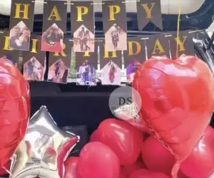 Car Boot Birthday Decoration in Delhi NCR with red balloons, foil hearts, and personalized photo banner by Dream Spark Events