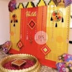 Stunning Grand Wedding Haldi Decor in Delhi NCR with marigold garlands and colorful umbrellas by Dream Spark Events