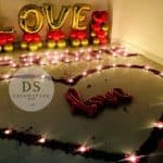 Love theme decoration Package with red and white balloons and fairy lights by Dream Spark Events
